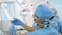 An anesthesiologist prepares an IV drip in operating room. At MGB, in inpatient cases, a majority of patients do at some point require IV fluids.