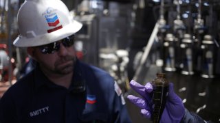 Offshore workers examine hydrocarbon samples aboard the Chevron Corp. Jack/St. Malo deepwater oil platform in the Gulf of Mexico off the coast of Louisiana, U.S., on Friday, May 18, 2018.