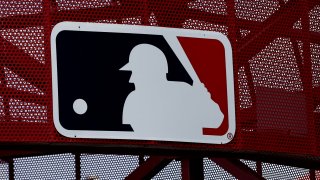 A Major League Baseball logo at Angel Stadium in Anaheim, California, May 22, 2022.