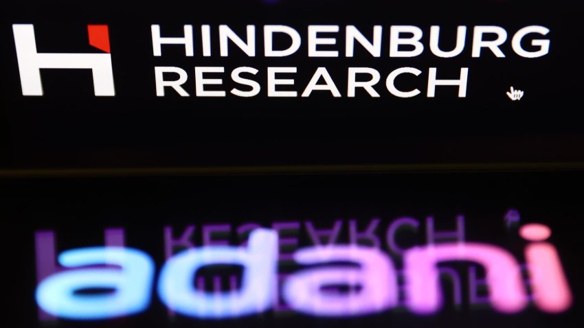 Hindenburg Research website displayed on a laptop screen and Adani logo displayed on a phone screen are seen in this illustration photo taken in Krakow, Poland on February 2, 2023.