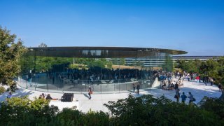 Peopl walk outside Steve Jobs Theater at the Apple Park campus before Apple’s “It’s Glowtime” event in Cupertino, California, on Sept. 9, 2024.