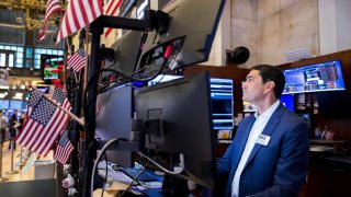 Traders work on the floor of the New York Stock Exchange.