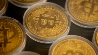 Gold Bitcoins are seen in the window of a Bitcoin and cryptocurrency exchange office on November 08, 2024 in Istanbul, Turkey. 