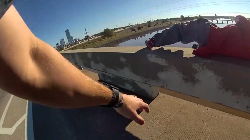 Bodycam of police officer rescuing man on bridge