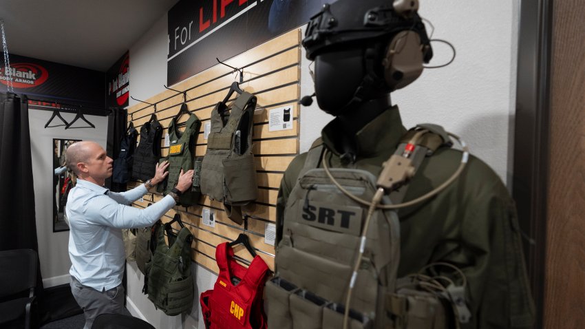 Veteran and business owner Jackson Dalton arranges protective gear at the Black Box Safety offices