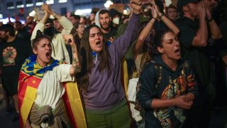 Demonstrators shout slogans as they gather for a protest organized by social and civic groups, denouncing the handling of recent flooding under the slogan “Mazón, Resign,” aimed at the president of the regional government Carlos Mazon, in Valencia, Spain, Saturday, Nov. 9, 2024.