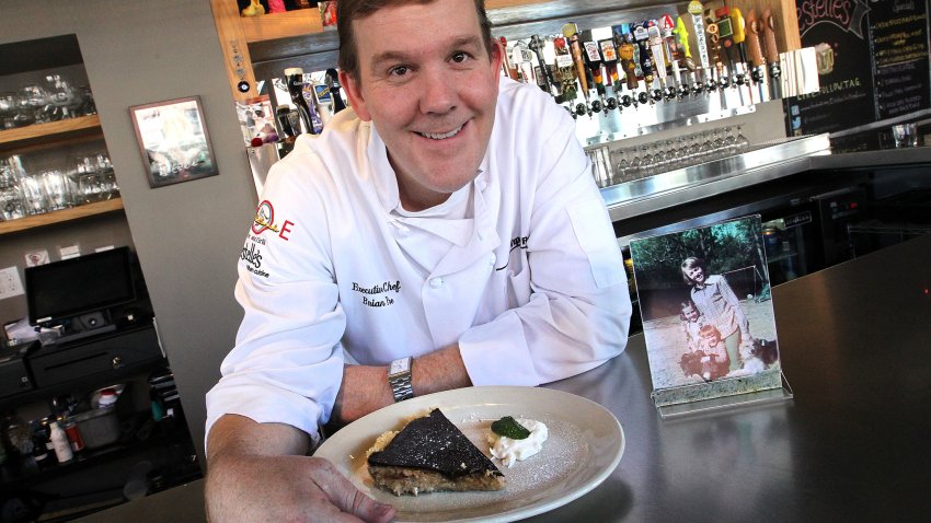 (Boston, MA, 05/06/14) Executive chef Brian Poe of  Estelle’s.   He learned to cook from his late mom ? who was blind.  With a picture of him his sister and mother Patricia and his peanut butter chocolate pie, which was one of his mom’s favorite dishes on Tuesday,  May  06, 2014.  (Staff photo by Matt Stone) (Photo by Matt Stone/MediaNews Group/Boston Herald via Getty Images)