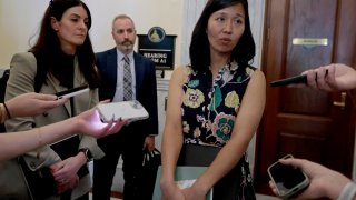 Boston, MA – July 16: After she testified at a State House hearing about her home rule petition on temporary property tax classification, Boston Mayor Michelle Wu talked to the media. Ashley Groffengberger, left, the City’s CFO and collector-treasurer and Nicholas Ariniello, commissioner assessing, also testified. (Photo by Pat Greenhouse/The Boston Globe via Getty Images)