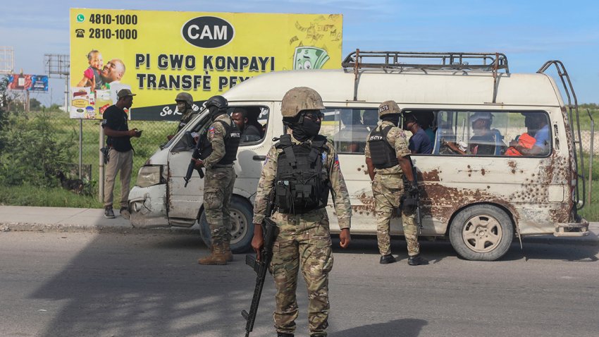 Police officers patrol near the Toussaint Louverture International Airport in Port-au-Prince, Haiti, Tuesday, Nov. 12, 2024.