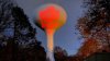 New Trump image projected onto Hanson water tower washed out with bright lights