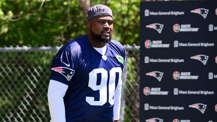 Jun 10, 2024; Foxborough, MA, USA; New England Patriots defensive tackle Christian Barmore (90) walks to the practice fields for minicamp at Gillette Stadium. Mandatory Credit: Eric Canha-USA TODAY Sports