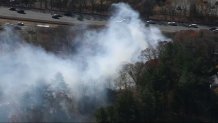 Smoke rising from a brush fire in Reading, Massachusetts, near I-93 on Friday, Nov. 8, 2024.