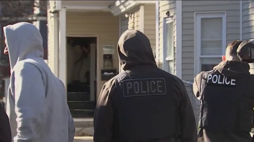 Police outside an apartment building in Lawrence, Massachusetts, after a chase on Tuesday, Nov. 12, 2024.