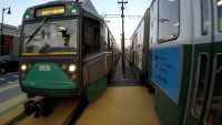 A file photo of MBTA Green Line trains passing each other.