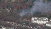 Smoke rising from a brush fire in Reading, Massachusetts, near I-93 on Friday, Nov. 8, 2024.