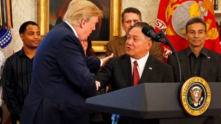 President Donald Trump introduces Broadcom CEO Hock Tan prior to Tan announcing the repatriation of his company’s headquarters to the United States from Singapore during a ceremony in the Oval Office of the White House, in Washington, DC, November 2, 2017.