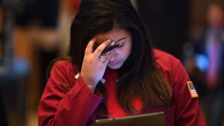 A trader reacts during the opening bell at the New York Stock Exchange (NYSE) in New York City.