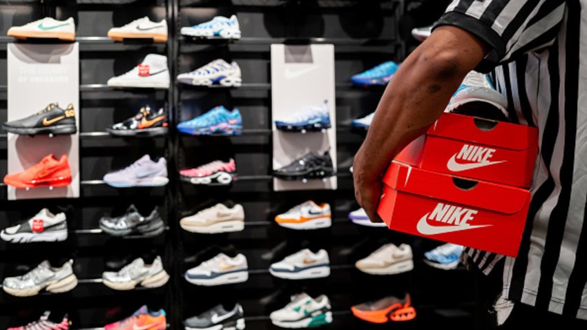 An employee carries shoe boxes at the Footlocker retail store in the Barton Creek Square Mall on August 28, 2024 in Austin, Texas.