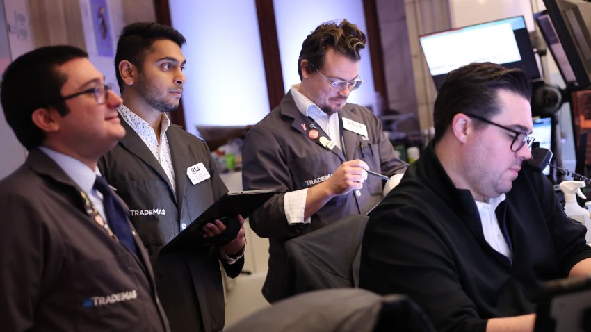 Traders work on the floor of the New York Stock Exchange during morning trading on November 26, 2024 in New York City.