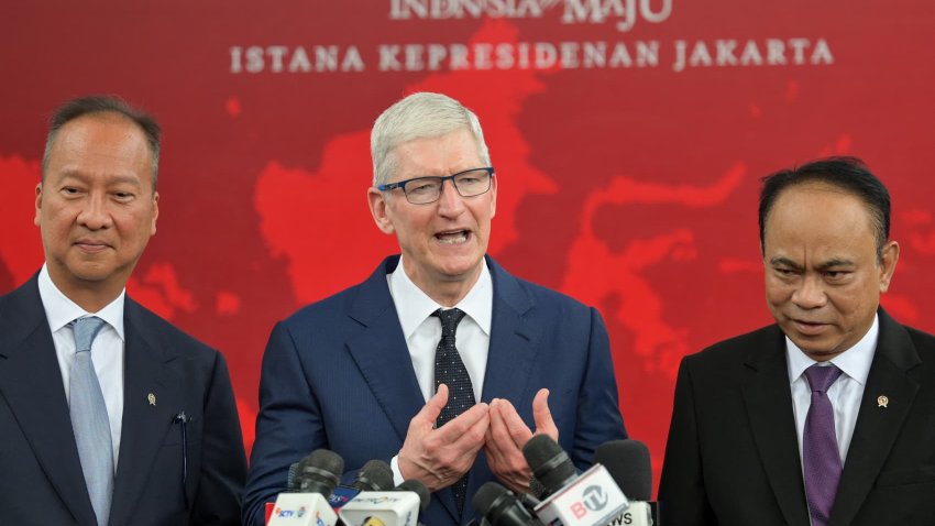 Apple CEO Tim Cook (center) speaking alongside Indonesian Minister of Communication and Information Budi Arie Setiadi (right) and Indonesian Minister of Industry Agus Gumiwang Kartasasmita during a press conference after meeting with Indonesia’s President Joko Widodo at the Merdeka Palace in Jakarta on April 17, 2024.