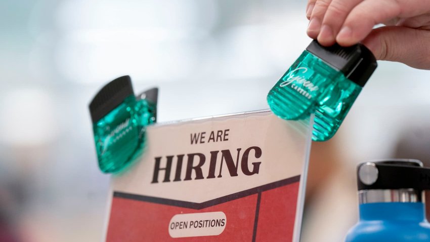 Hiring signage displayed at a job and resource fair hosted by the Mountain Area Workforce Development Board in partnership with NCWorks in Hendersonville, North Carolina, US, on Tuesday, Nov. 19, 2024. 