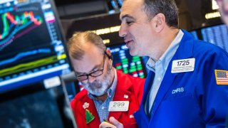 Traders work at the New York Stock Exchange on Dec. 17, 2024.