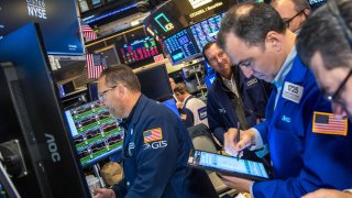 Traders work at the New York Stock Exchange on Dec. 17, 2024.