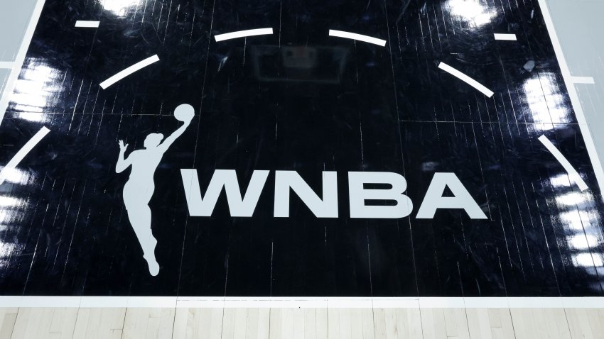 A WNBA logo is shown on the court