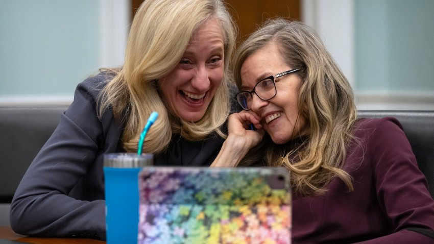 Rep. Abigail Spanberger, D-Va., left, reacts with Rep. Jennifer Wexton, D-Va., during an interview with the Associated Press on Capitol Hill, Wednesday, Dec. 4, 2024, in Washington.