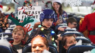 Participants prepare for take-off during the United Airlines annual “fantasy flight” to a fictional North Pole at Denver International Airport, Dec. 14, 2024, in Denver.