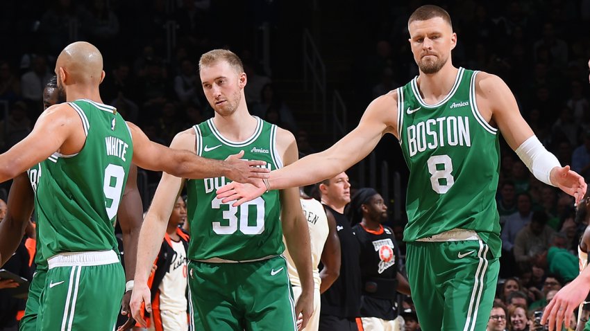 Celtics teammates Derrick White, Sam Hauser and Kristaps Porzingis