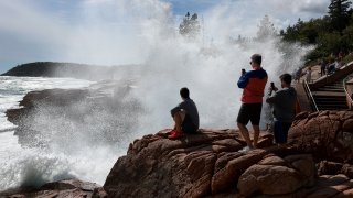 BAR HARBOR, MAINE – SEPTEMBER 15: People watch as a wave breaks ashore at Thunder Hole in Acadia National Park before the possible arrival of Hurricane Lee on September 15, 2023 in Bar Harbor, Maine. Most of Maine is now in a Tropical Storm warning as Lee continues its path up the coastline. Forecasters say it will remain large and dangerous. (Photo by Joe Raedle/Getty Images)