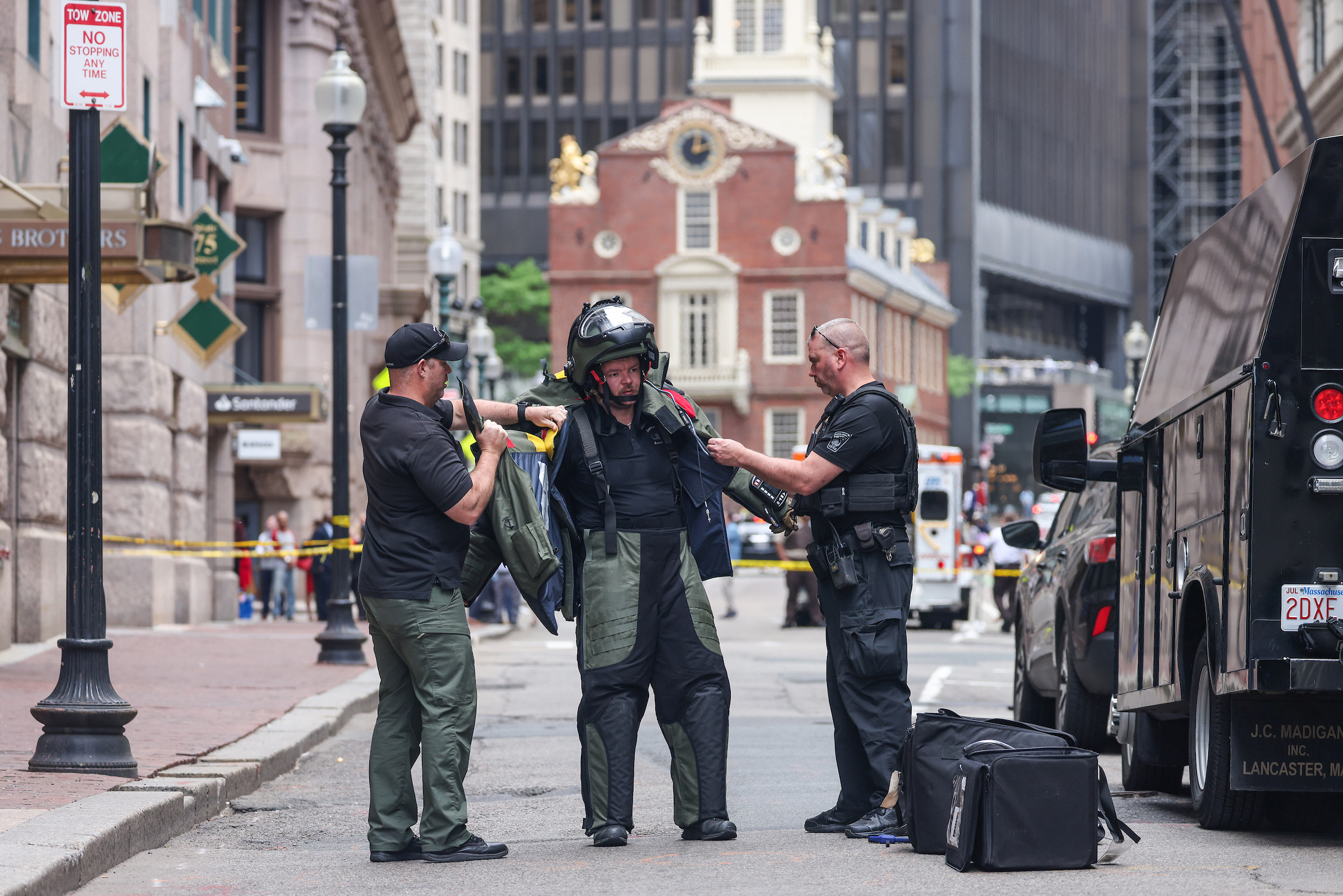 May 29, 2024: A Boston police explosive ordnance expert prepares to examine a suspicious package on Boston’s State Street. The package was deemed harmless, though the area’s two-hour closure affected lunch hour businesses.