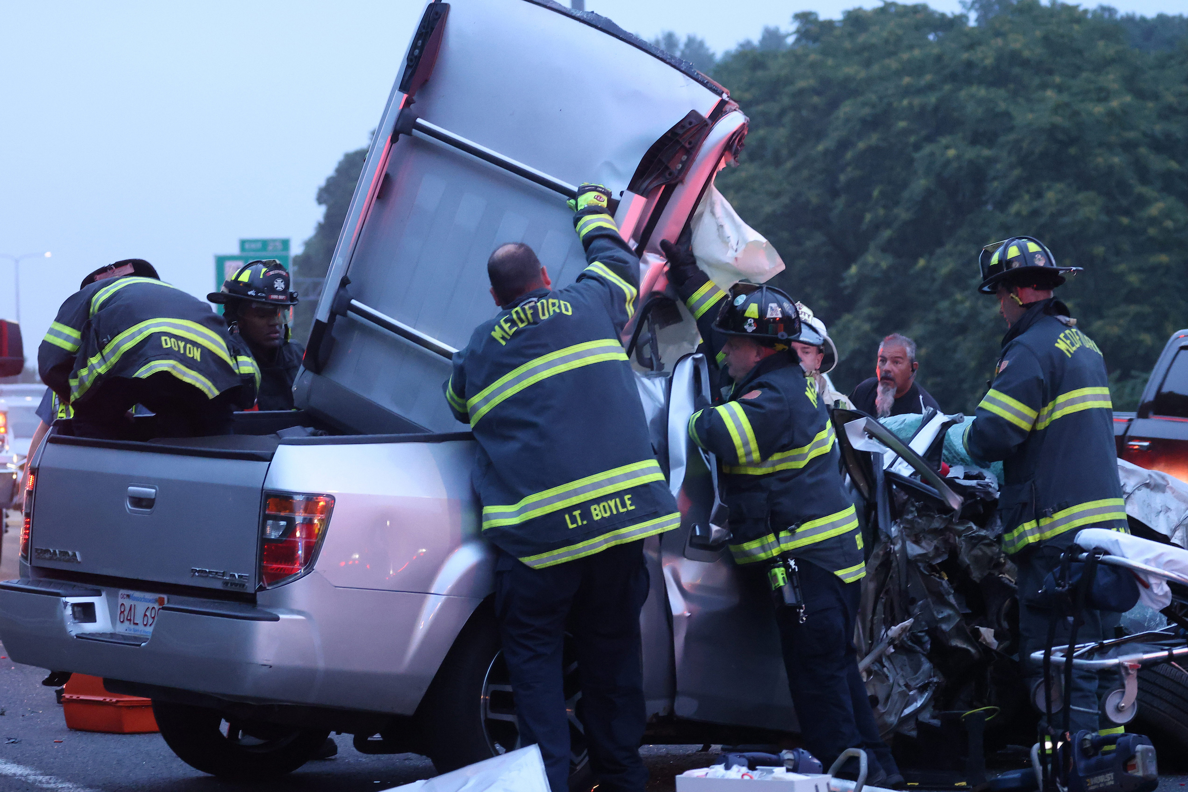 July 25, 2024: Medford firefighters work to free a man from an early morning three-car crash on I-93. Several non-life-threatening injuries were reported.