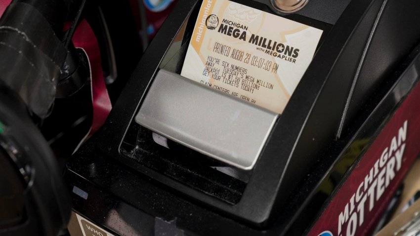 A Mega Millions lottery ticket is purchased and printed in the BP on Woodward Avenue in Detroit on Tuesday, Aug. 8, 2023.