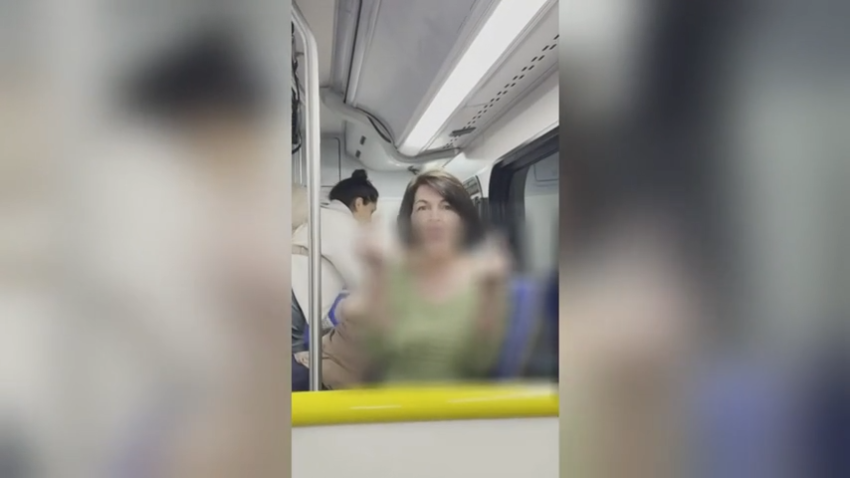 A woman giving two middle fingers to a man at Los Angeles International Airport during a racist tirade about the man's Indian heritage.