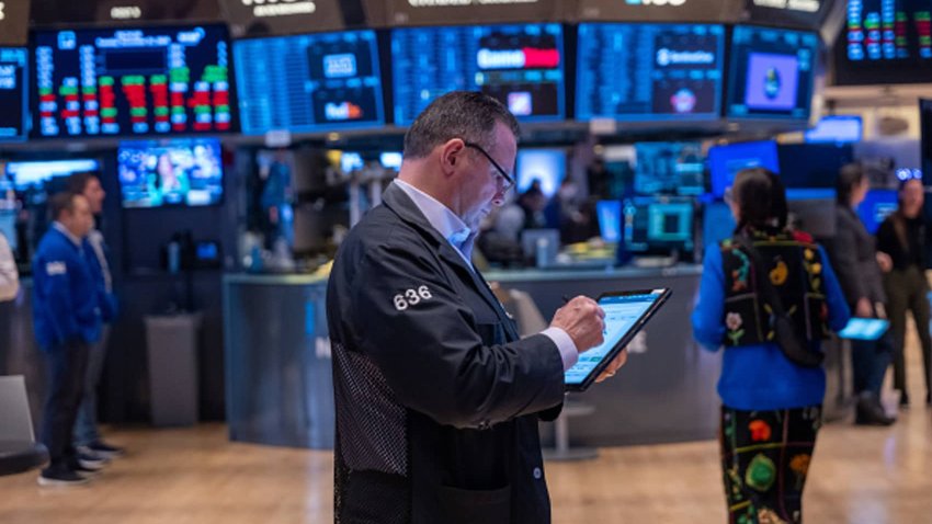 Traders work on the floor of the New York Stock Exchange on the last day of trading for the year on Dec. 31, 2024 in New York City. 