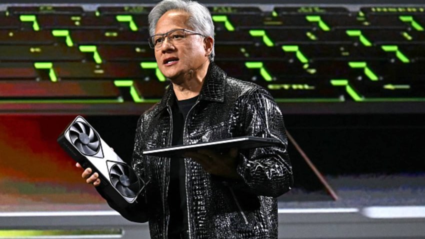 Nvidia CEO Jensen Huang holds a Blackwell GeForce RTX 50 Series GPU (L) and a RTX 5000 laptop as he delivers a keynote address at the Consumer Electronics Show (CES) in Las Vegas, Nevada on January 6, 2025. 