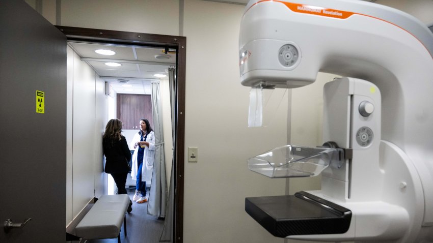 Nurse practitioner Manisha Ati, right, shows Linda Arous, assoc. medical director of Wesley Health Center, City of Hopes new mobile cancer prevention and screening clinic