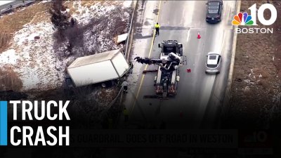 Box truck crashes through guardrail in Weston