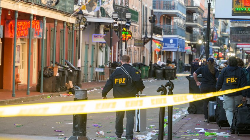 FBI investigators arrive at the scene where the white Ford F-150 pickup truck that crashed into a work lift after allegedly driving into a crowd of New Year’s revelers in the French Quarter of New Orleans, Louisiana, on January 1, 2025. At least 10 people were killed and 30 injured Wednesday when a vehicle plowed overnight into a New year’s crowd in the heart of the thriving New Orleans tourist district, authorities in the southern US city said. (Photo by Matthew HINTON / AFP) (Photo by MATTHEW HINTON/AFP via Getty Images)